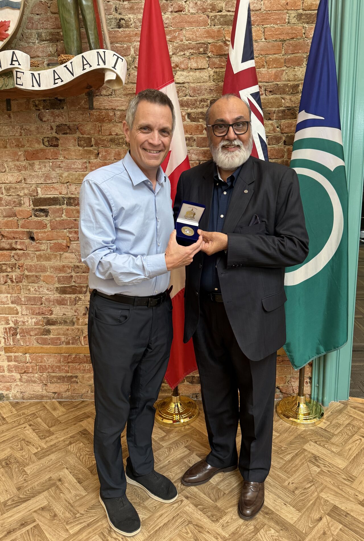 Mayor of Ottawa Mark Sutcliffe Daljit S. Nirman of Nirmans Law with the official #Ottawa200 commemorative pin presented by Mayor Mark Sutcliffe for community contributions.